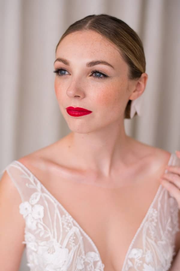 Sleek bridal hairstyle natural makeup for pale skin tone red lip
