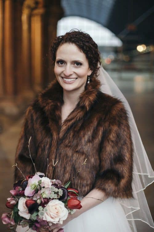 Bride wearing a short faux fur for winter wedding London natural bridal makeup chic bridal fur-cruelty-free-bridal-makeup-atrist