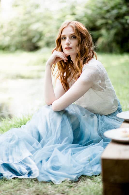 Bridal makeup and hair for red hair two piece dress with blue skirt