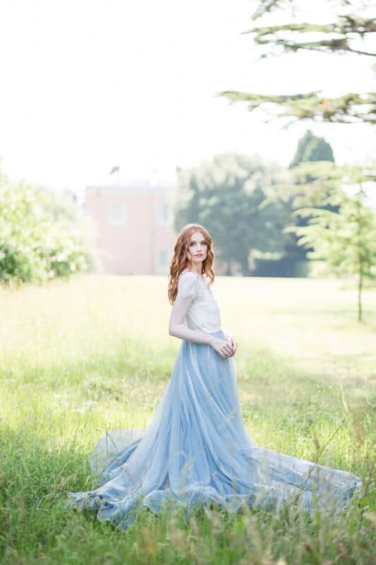 Bridal makeup and hair for red hair two piece dress with blue skirt