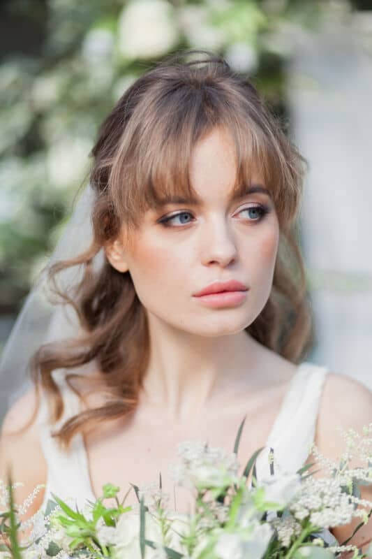 Romantic portrait of a bride wearing soft smokey eye makeup