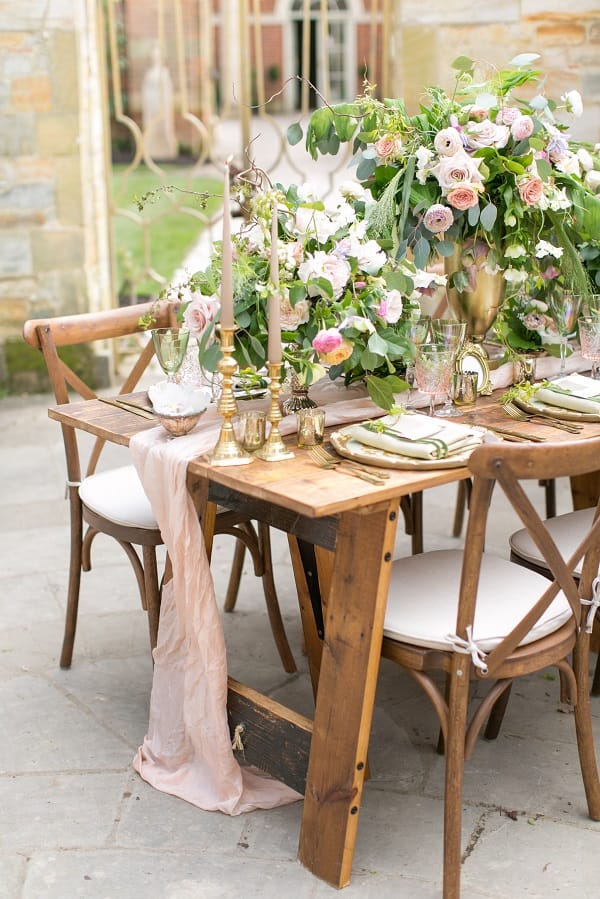 Romantic floral wedding table setup in Hever Castle